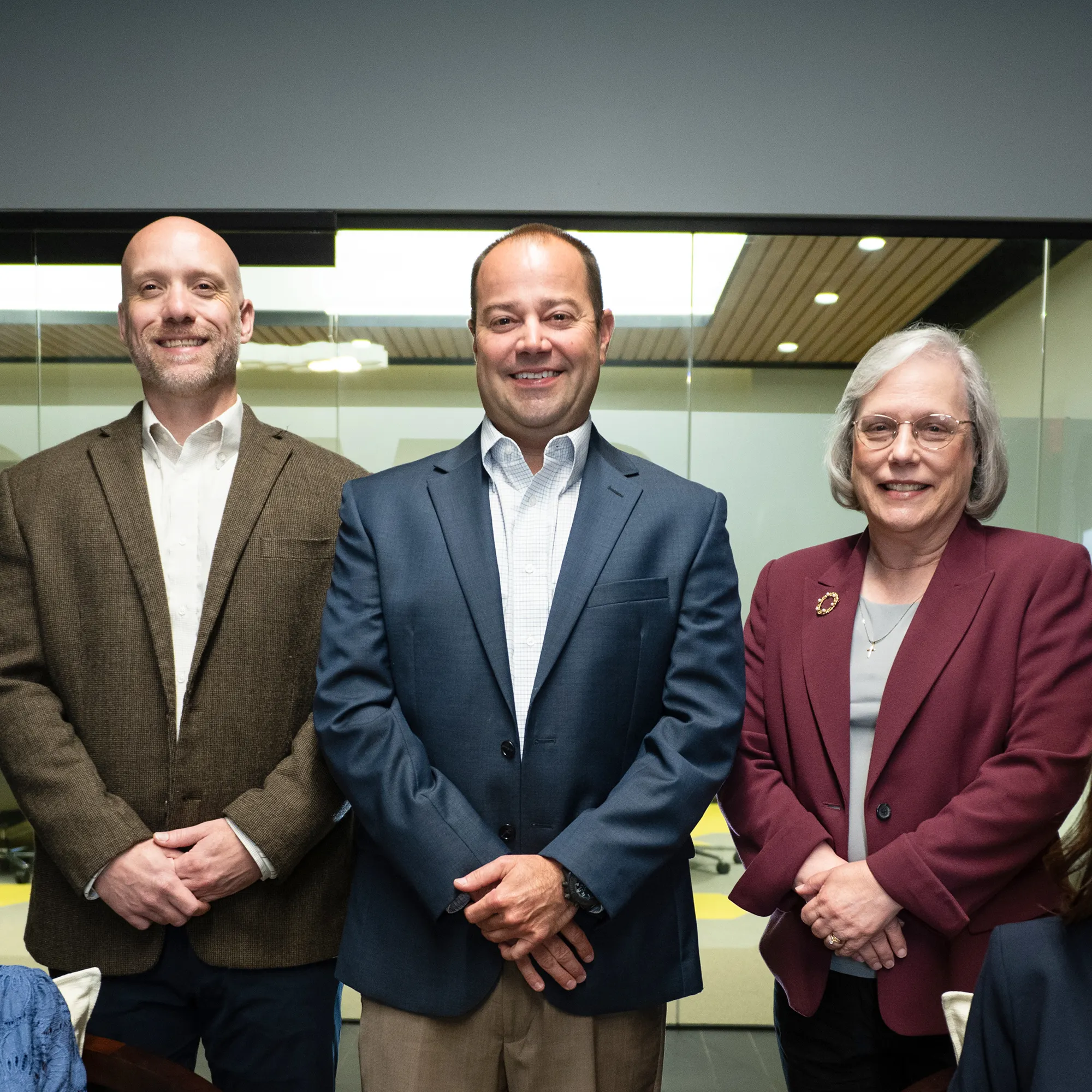 AlaCOMP leaders standing together in the company office.