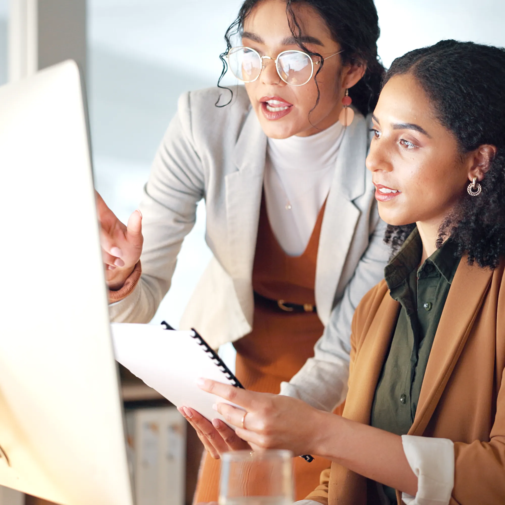 Insurance professionals reviewing coverage information