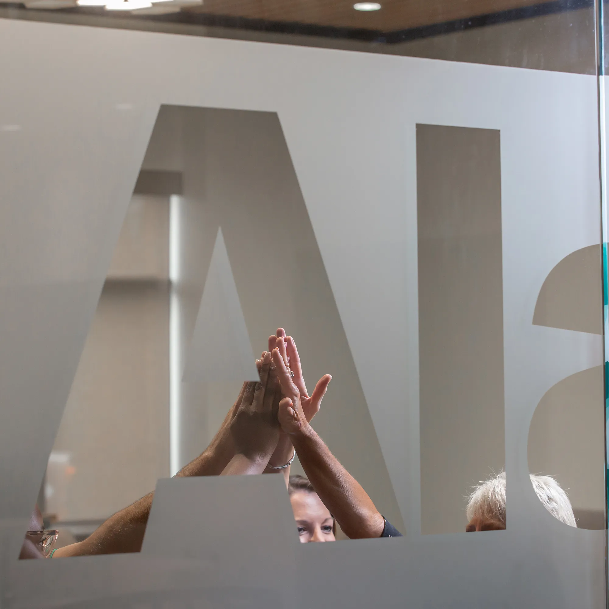 AlaCOMP team members collaborating around a conference table.