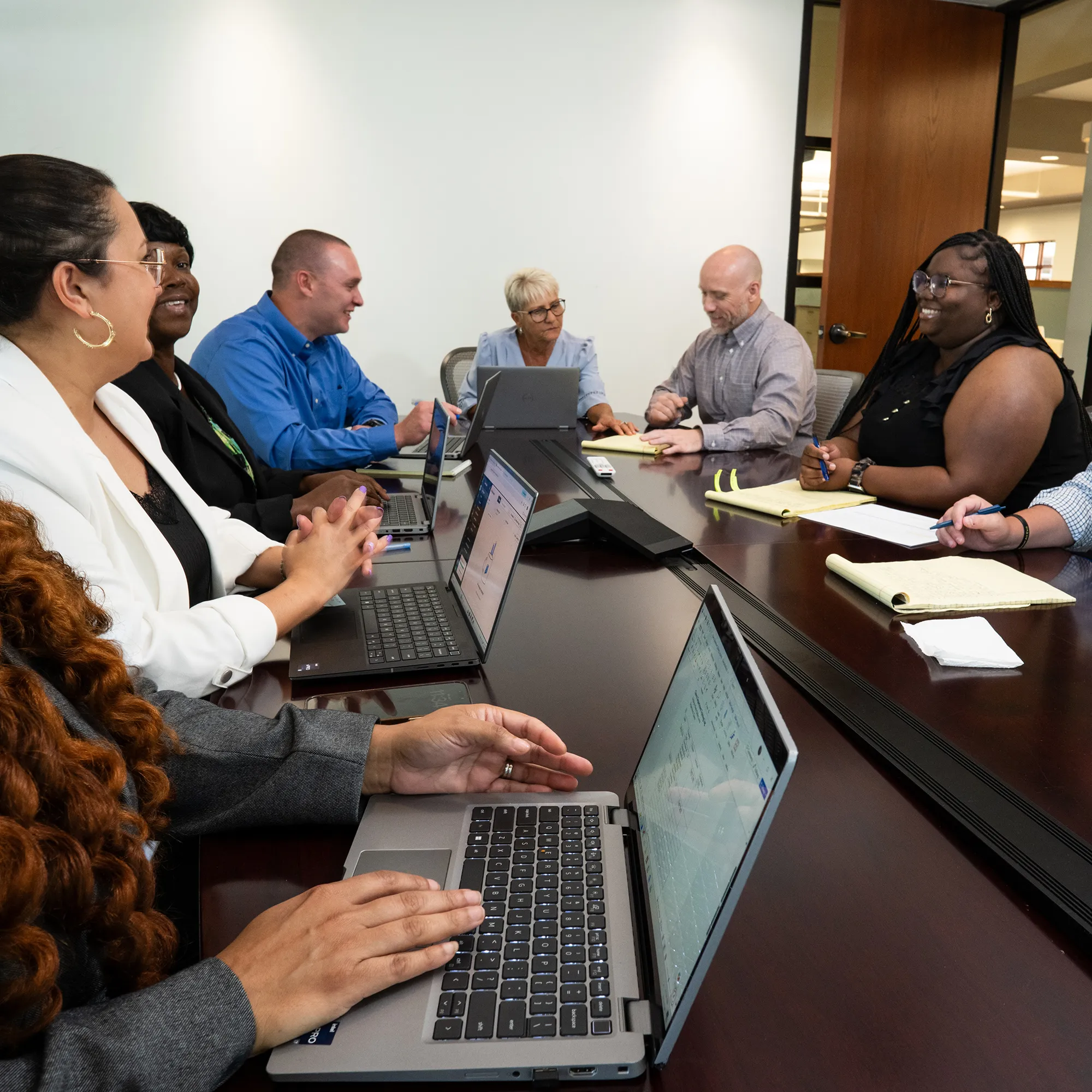 AlaCOMP team members collaborating around a conference table.